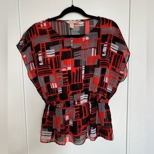 Banana Republic shirt, tight around the waist, flowing at the bottom.